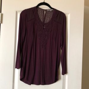 Purple top with lacy inserts.